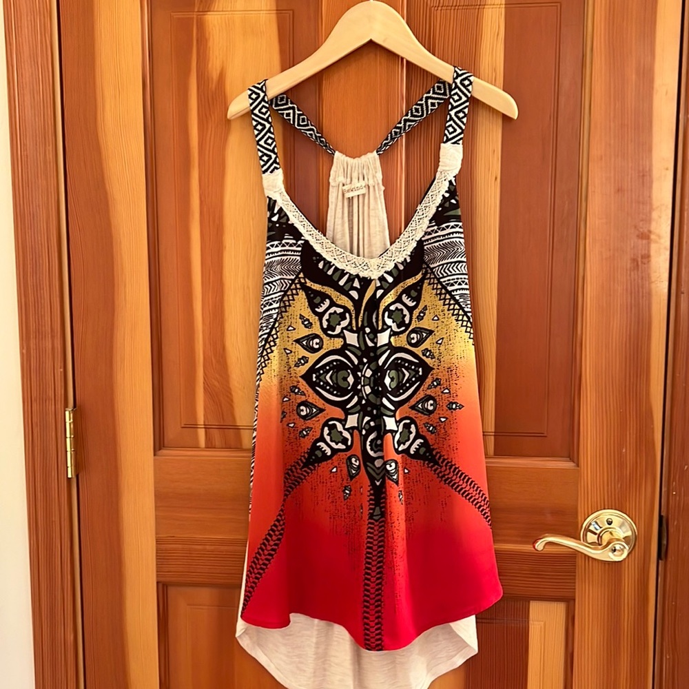 Funky racer back tank. Poly front and cotton back.